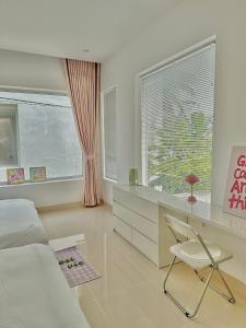 Ein Bett oder Betten in einem Zimmer der Unterkunft Jeju Homestay