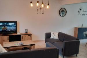 TV a/nebo společenská místnost v ubytování La Maison Enzo
