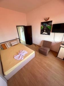a bedroom with a bed with a bow on it at ТРАКАРТ-ПАРК in Plovdiv