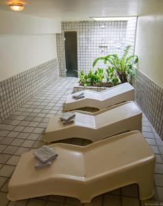 a row of sinks in a public restroom at Hotel Doce Mar in Búzios