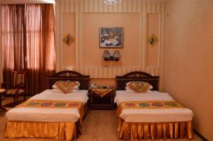 Postel nebo postele na pokoji v ubytování ORIYO DUSHANBE HOTEL
