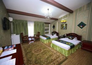 Postel nebo postele na pokoji v ubytování ORIYO DUSHANBE HOTEL