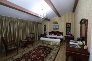 Postel nebo postele na pokoji v ubytování ORIYO DUSHANBE HOTEL