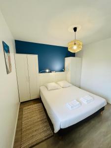 Posteľ alebo postele v izbe v ubytovaní Appartement vue mer, terrasse parking et plage