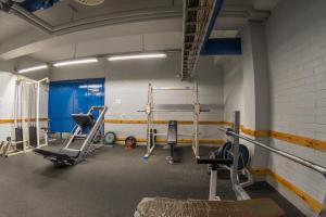 a gym with several equipment in a room at LentoHotelli in Kauhava