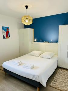 Posteľ alebo postele v izbe v ubytovaní Appartement vue mer, terrasse parking et plage