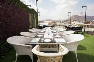 a row of tables and chairs on a patio at Agariya Haveli near Pichola Lake, Udaipur in Udaipur