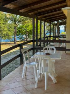 a white table and two chairs on a patio at Villaggio Villa Lubrense in Massa Lubrense