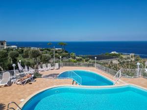 a swimming pool with a view of the ocean at Villaggio Villa Lubrense in Massa Lubrense
