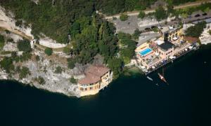 an aerial view of a house in the water at Apartments Excelsior in Riva del Garda