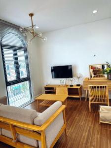 a living room with a couch and a tv at Z Homestay 2 Phú Quốc in Phú Quốc