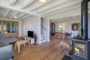 a living room with a couch and a table at La Senpere - Maison à 20min de Saint Jean de Luz in Saint-Pée-sur-Nivelle