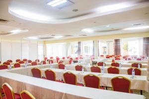 a conference room with tables and chairs and tablesktop at Bomah Hotel Limited in Gulu +43 photos
