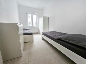 Ένα ή περισσότερα κρεβάτια σε δωμάτιο στο Work & Stay in Troisdorf