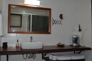 Ванна кімната в Pousada Pinhal Alto