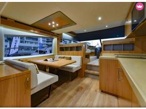a kitchen and dining area of a motor yacht at Luxury 2 Bed Boat With Crew in Ban Laem Hin