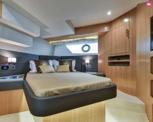 a bedroom in a boat with a bed in it at Luxury 2 Bed Boat With Crew in Ban Laem Hin