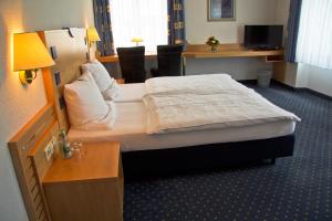 Postel nebo postele na pokoji v ubytování Hotel Krone