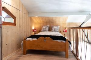 Säng eller sängar i ett rum på Chalet : Secteur Gérardmer.
