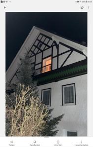 a window on the side of a building with a tree at Haus Jahn in Rohrbach