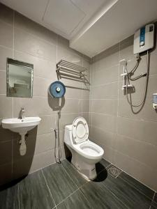 a bathroom with a toilet and a sink at De UPTOWN Hotel @ P.J. 222 in Petaling Jaya