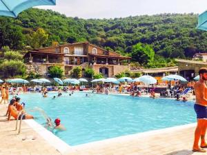 a group of people in a swimming pool at Le Rocce in Sant'Agata de' Goti