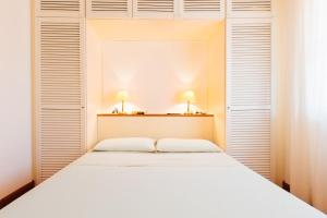 A bed or beds in a room at Residence Renaione