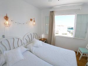 מיטה או מיטות בחדר ב-Apartamento 302 Castell Sol CB