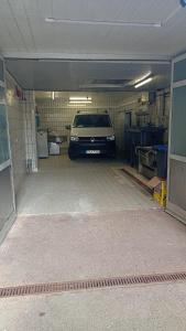 a car is parked in a garage at Zentrale Ferienwohnung mit Blick auf die Paulinskirche in Trier