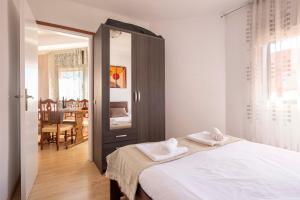 a bedroom with a bed with two towels on it at 5 min to the sea and 15 min to Barcelona center in Sant Adria de Besos
