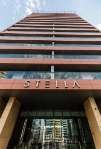 a tall building with a sign on it at Stella Stays Stunning 1 BDR Dubai Tecom Netflix Pool in Dubai