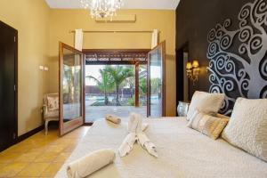 Ένα ή περισσότερα κρεβάτια σε δωμάτιο στο Villa Masé Fuerteventura +30 φωτογραφίες