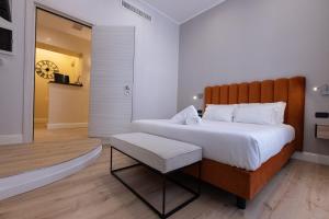 Ένα ή περισσότερα κρεβάτια σε δωμάτιο στο Relais At Via Veneto
