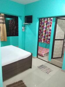 Cama o camas de una habitación en Colva Shepherds and Sabs Deluxe Apartments & Deluxe Rooms