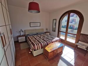 Postel nebo postele na pokoji v ubytování Domus Filigheddu - Trilocale Santa Teresa Gallura