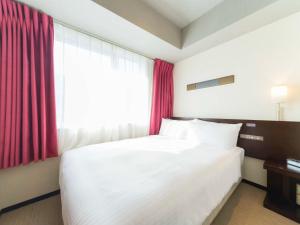 Giường trong phòng chung tại ibis Styles Kyoto Station