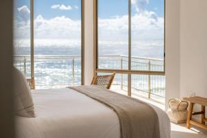 Ένα ή περισσότερα κρεβάτια σε δωμάτιο στο Oceans 8 - Oceanstays