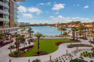 an aerial view of a park with a lake in the background at Conrad Orlando in Orlando