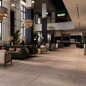 un vestíbulo con sofás y sillas en un edificio en Homewood Suites By Hilton Raleigh Downtown en Raleigh