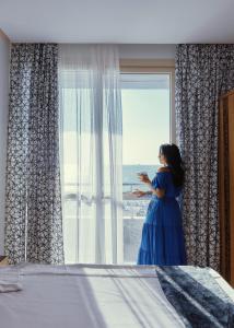A bed or beds in a room at El Mena Grand