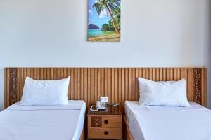 A bed or beds in a room at El Mena Grand