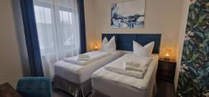 Ένα ή περισσότερα κρεβάτια σε δωμάτιο στο BusinessHotel Mühlenbeck