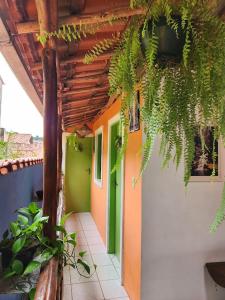 a hallway of a house with green and orange at Pousada Velho Garimpo in Lençóis