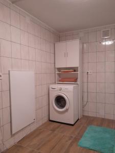 a kitchen with a washing machine in a room at Ferienwohnung 2 Jöbstl 
