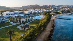 an aerial view of a resort with a body of water at Atlantica Beach Resort Kos in Kardamaina