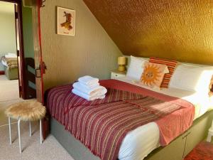 Ліжко або ліжка в номері Stable End Cottage