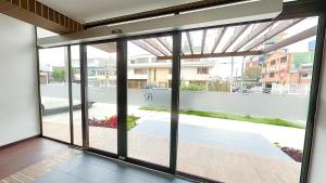 an open glass door with a view of a street at AZ Hotel in Bogotá