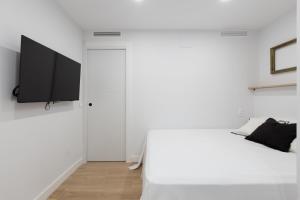 En eller flere senge i et værelse på Apartamento con vistas en Puerto Banús
