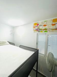 En eller flere senge i et værelse på Can Jané Port d Alcudia