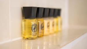 a row of bottles of mustard on a shelf at The Kings Arms Otterton in Budleigh Salterton